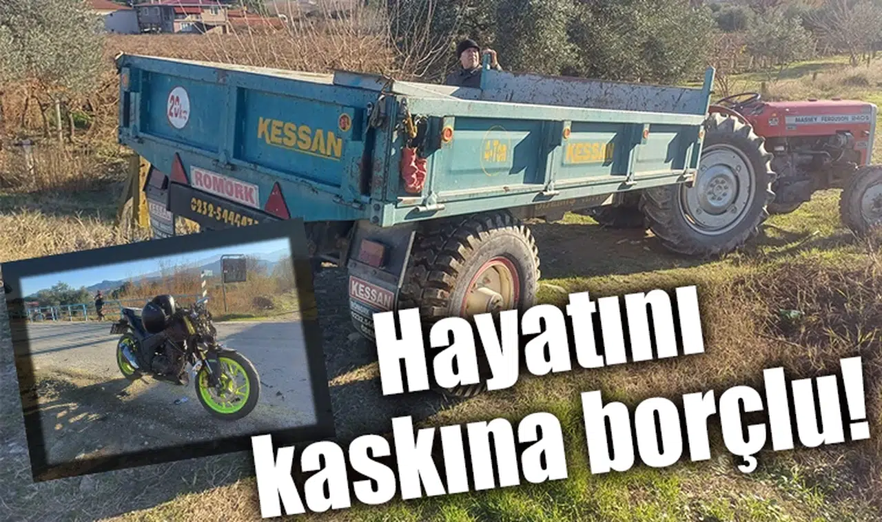 Traktör ile çarpışan motosiklet sürücüsünü kaskı kurtardı
