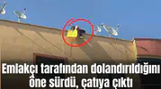 Emlakçı tarafından dolandırıldığını öne sürdü, çatıya çıktı