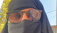 Çarşafla gezen erkek şahıs gözaltına alındı