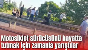 Motosiklet sürücüsünü hayatta tutmak için zamanla yarıştılar