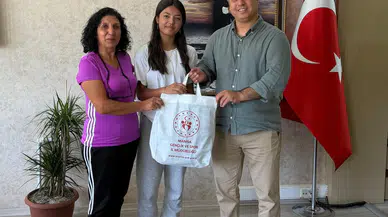 Müdür Öztürk'ten şampiyon atlete ödül