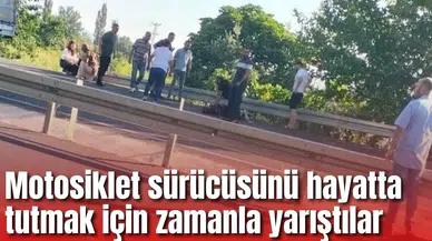Motosiklet sürücüsünü hayatta tutmak için zamanla yarıştılar